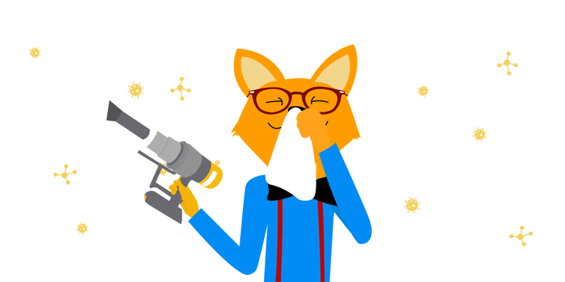 The Smart Home Fox smilingly holds a battery hoover against allergens in his hand.